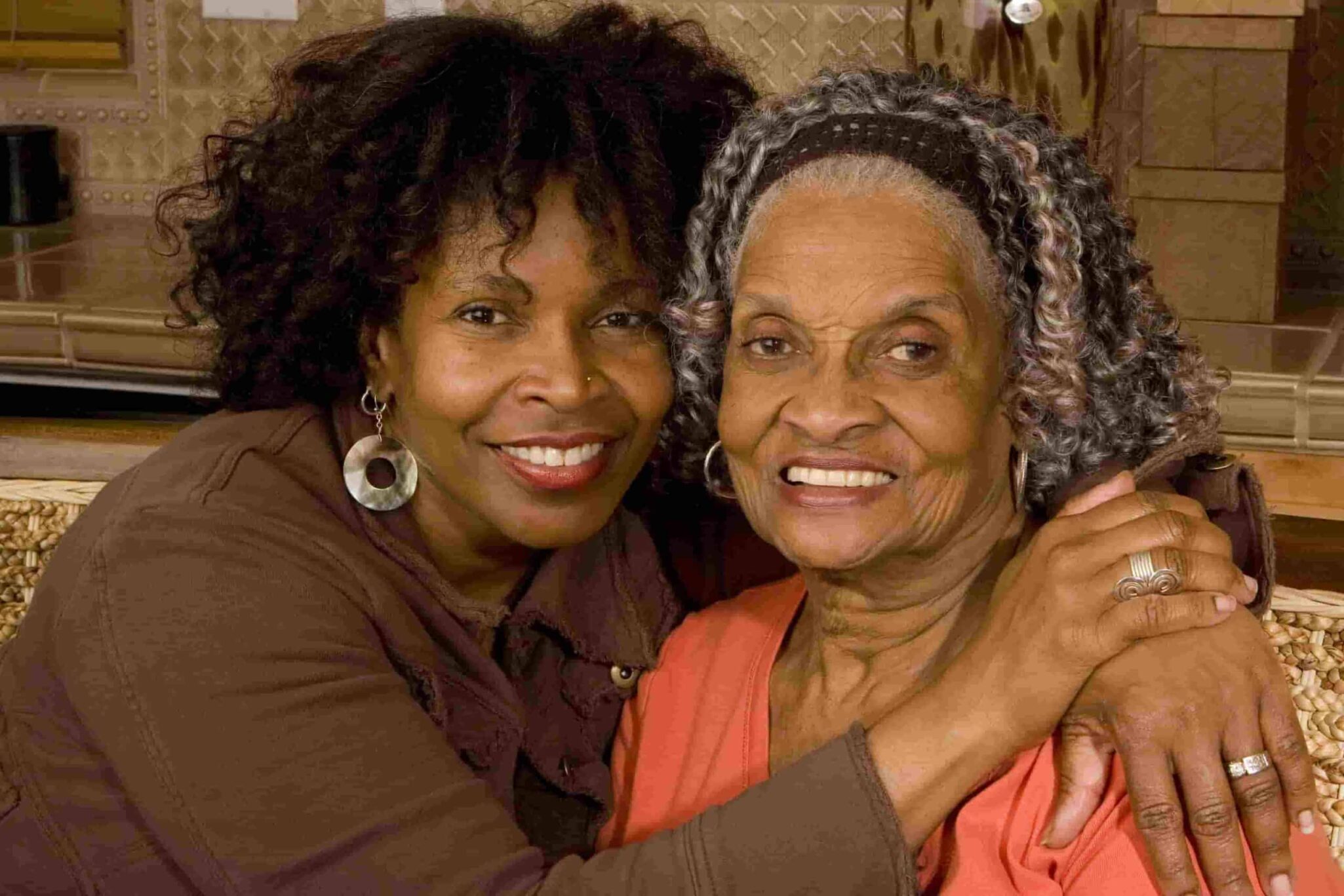 Two elderly women embracing